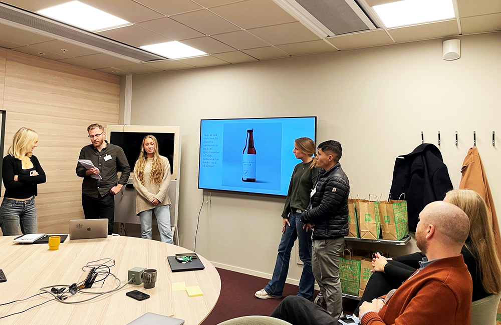 Students presenting in a group in a conference room at Coop