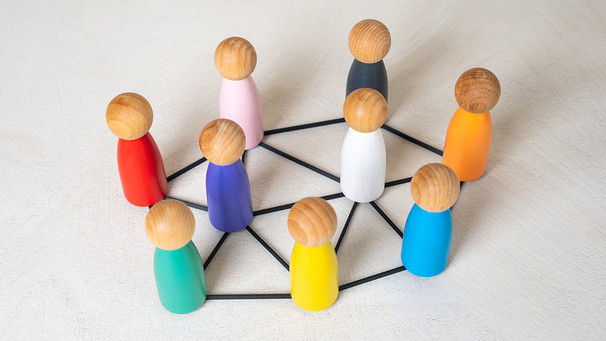 Multicolored figures of people are connected by lines. Multiculturalism, cooperation. Cultures and nations work together. Connection between countries. Diversity, international teamwork