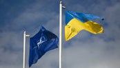 The national flag of Ukraine and NATO flag