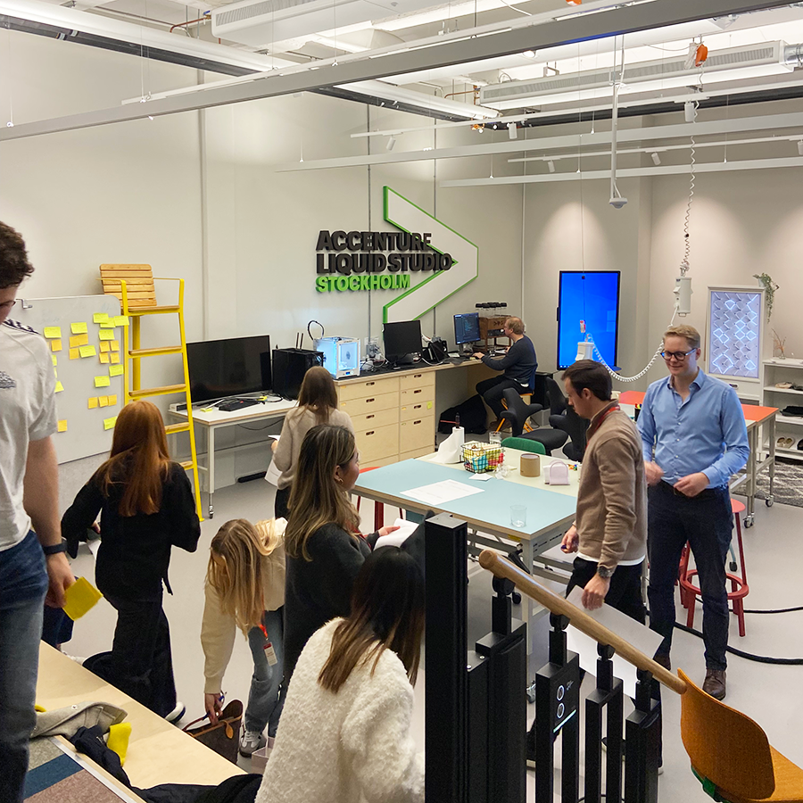 Students in motion and looking busy in i high ceiling bright studio room