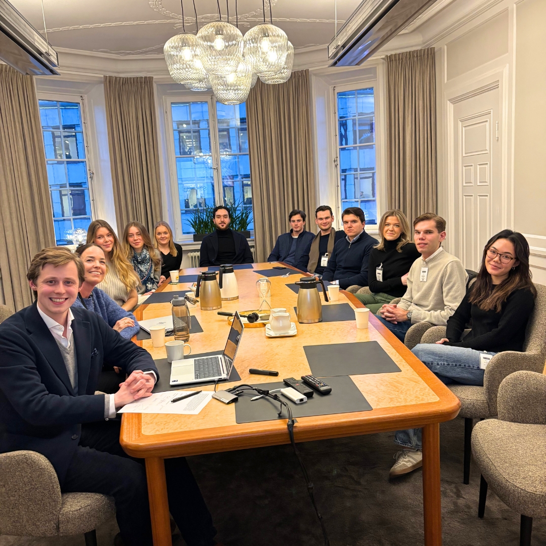 Students around a conference table at Svensk Handel (Swedish Commerce)