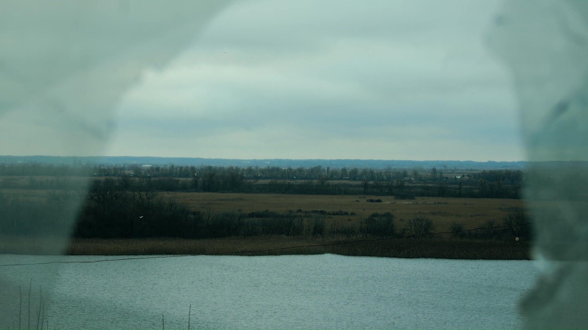 Still from Malashchuk and Khimei's video, showing the Dnipro River and landscape near Kherson