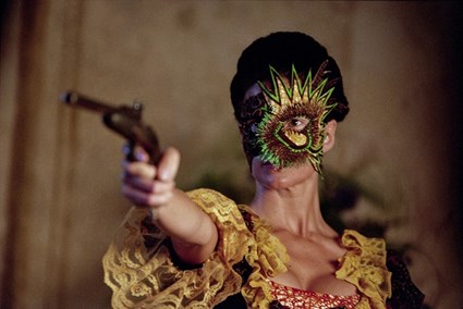 Still from Yinka Shonibare's film Un Ballo in Maschera, showing dancers in batik costumes