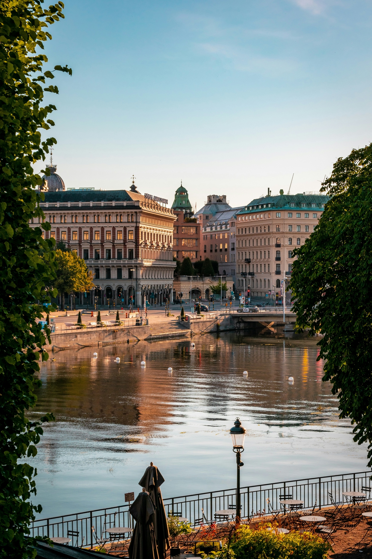 View of Stockholm, capital of Sweden, with water in the foreground and buildings rising behind it.