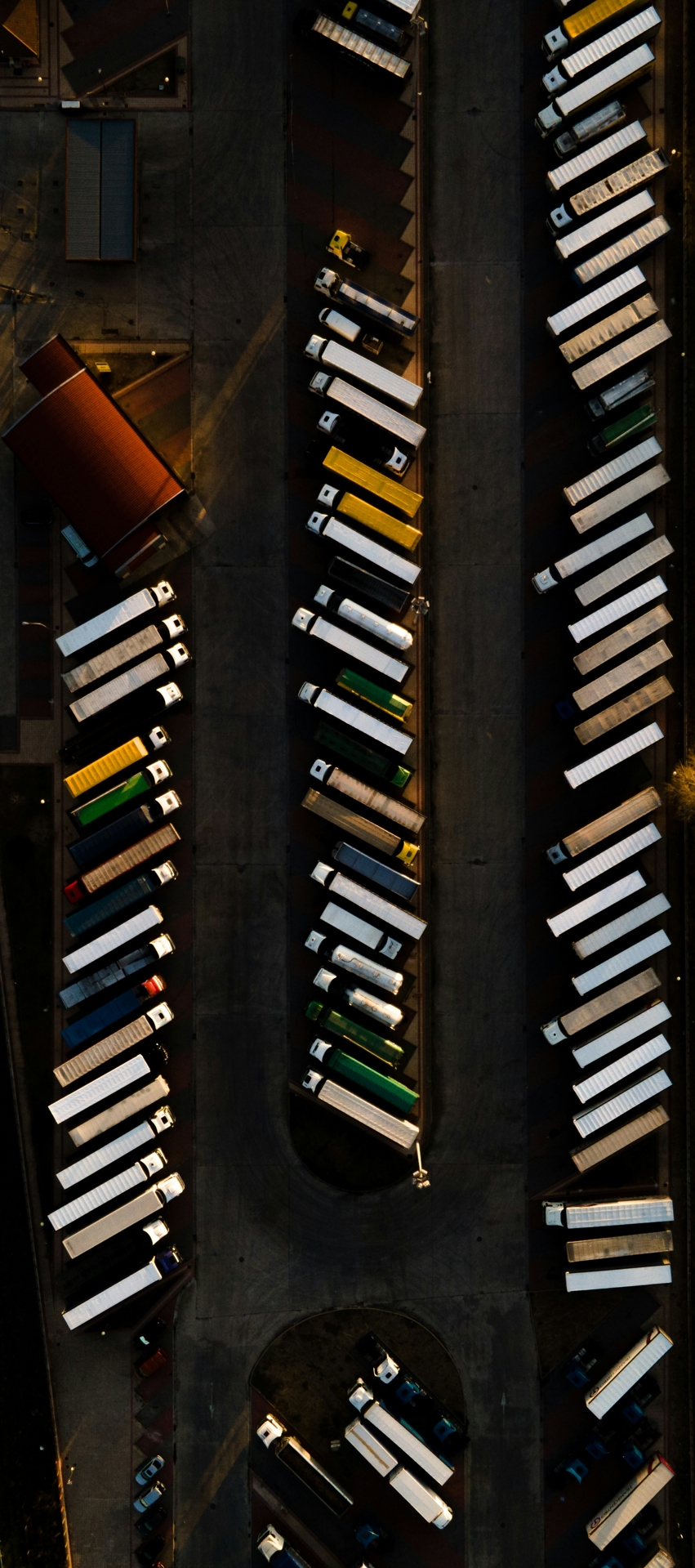 Birds-eye view of trucks at a depot.